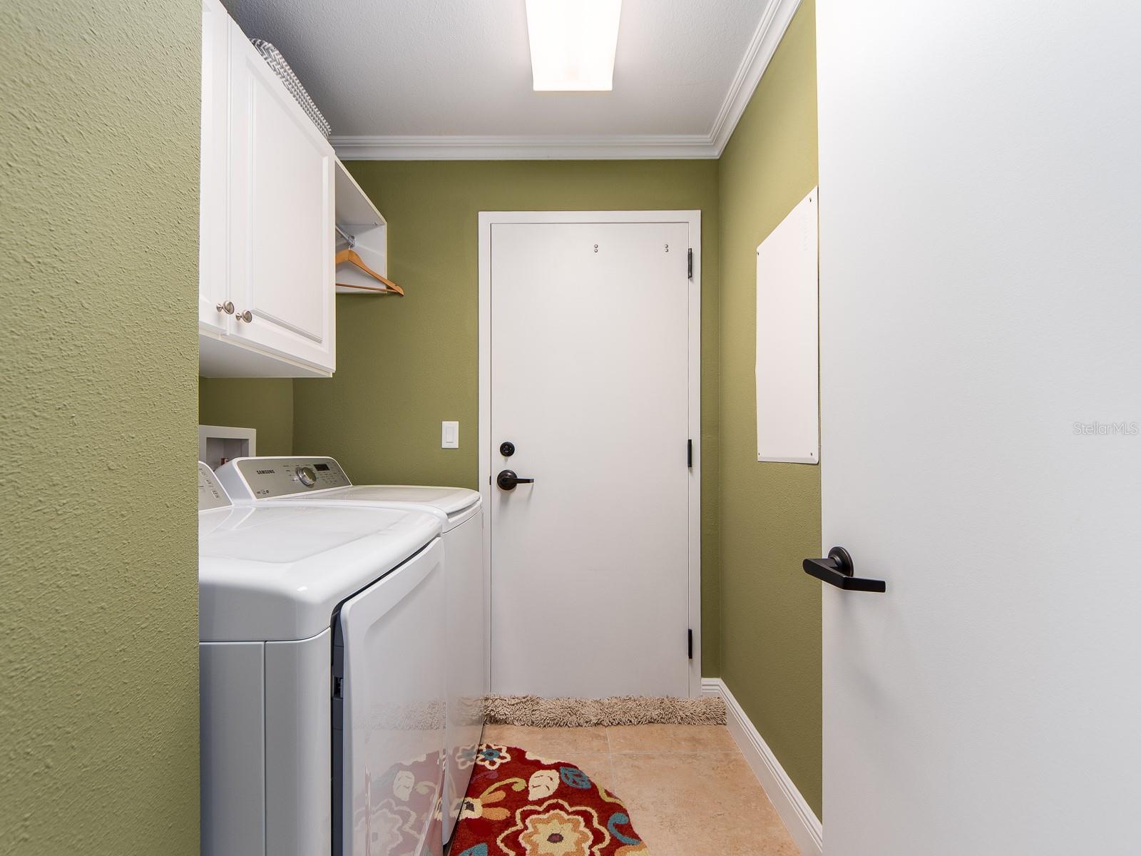 Laundry room with exit to mechanical/trash chute/stairwell