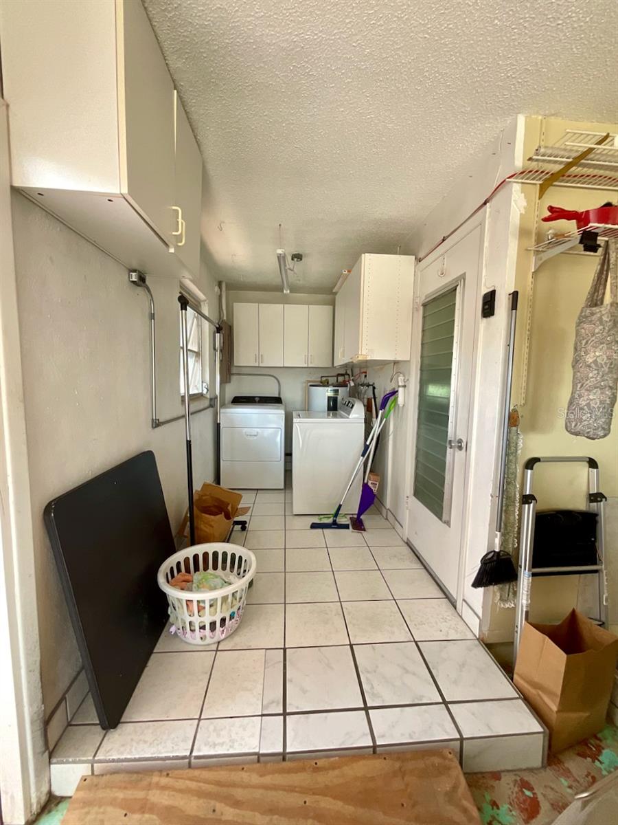 27-Garage laundry area with room for golf cart