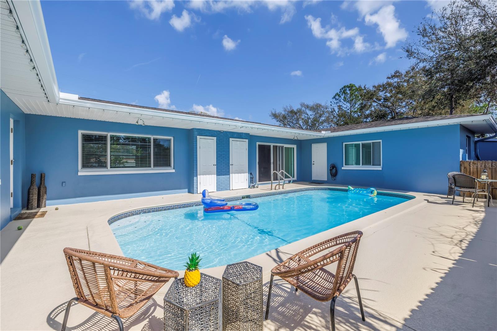 So much living space around the pool.  Private surround of the home to the pool