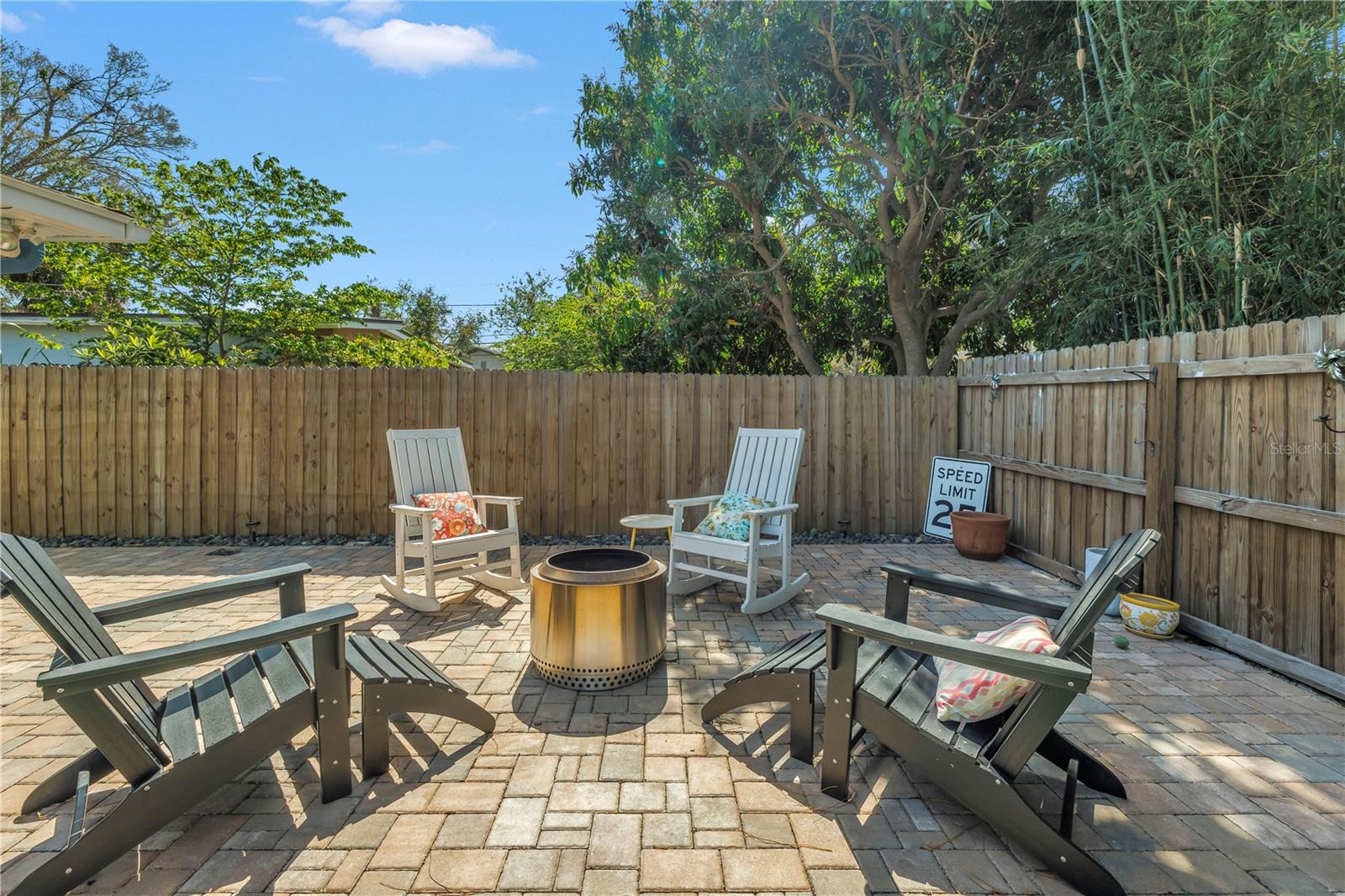 Pavered courtyard on the sided of the home perfect for evenings at the firepit