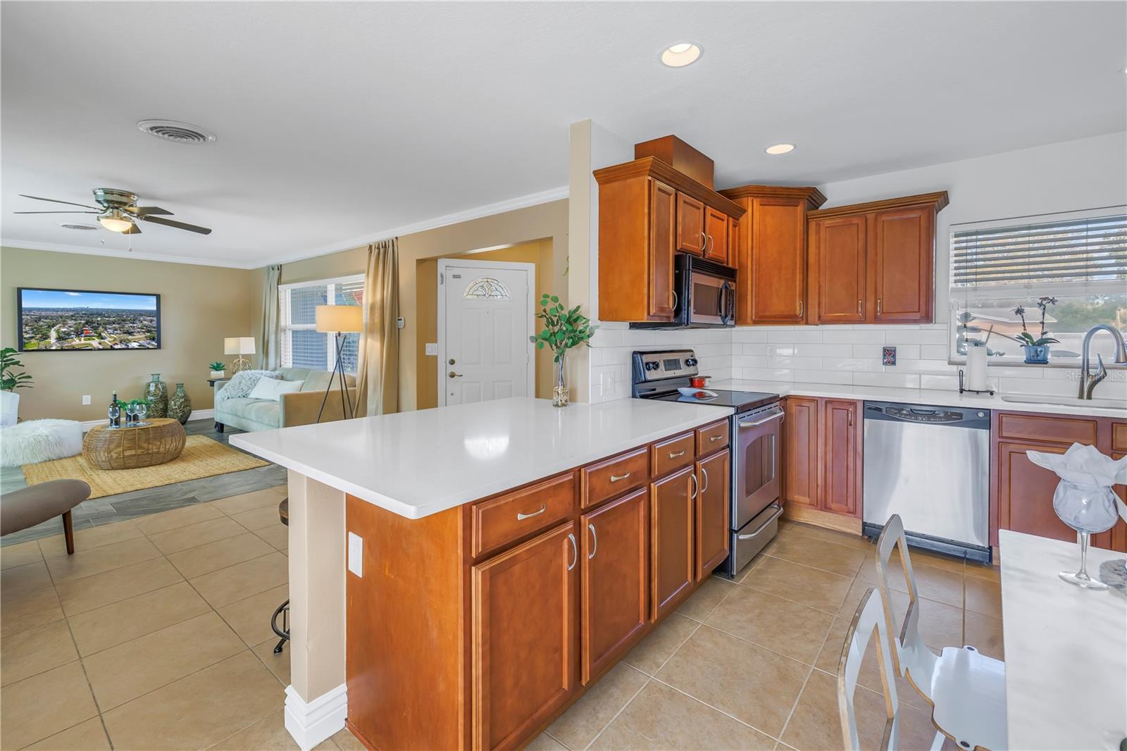 Open Kitchen plan to the living room and plenty of space to prep and eat