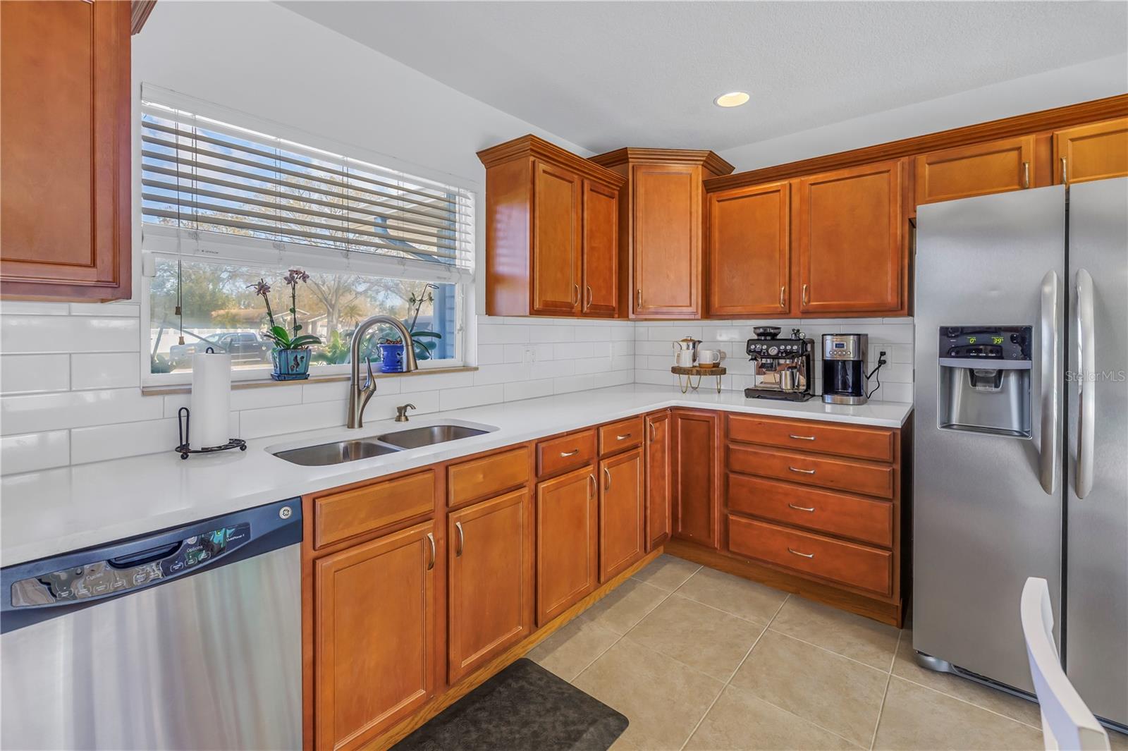 Stainless Appliances and large window over sink.  So much Prep Space