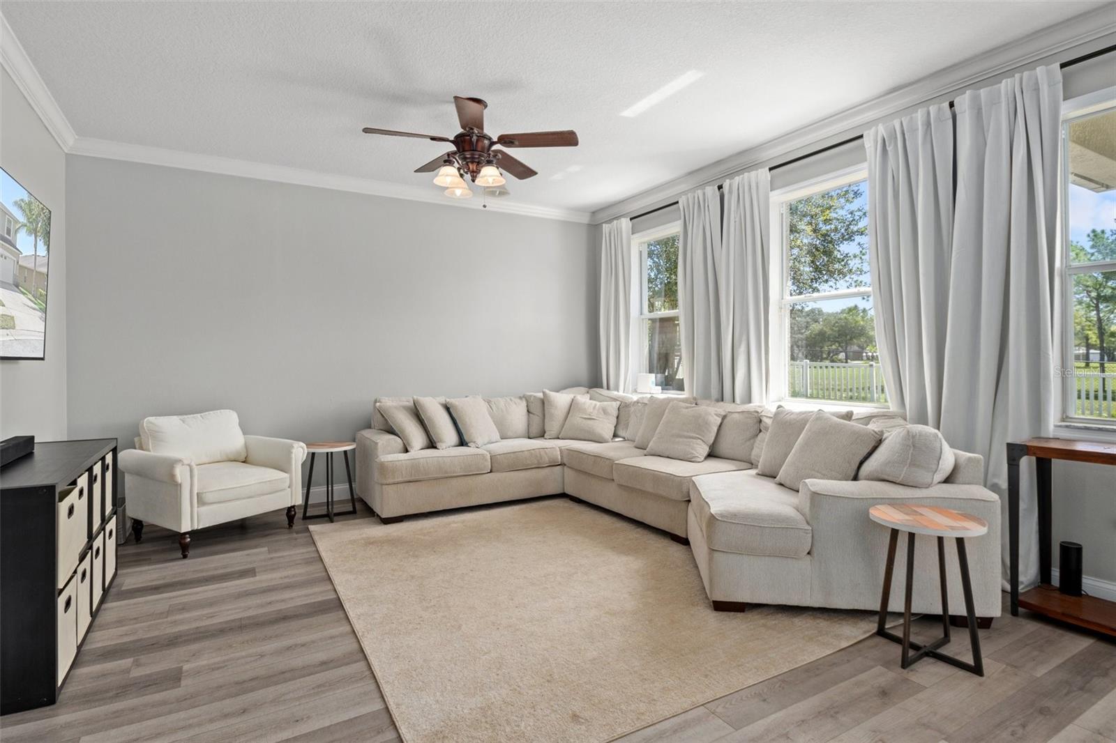 Light and Cheery Family Room Overlooking Backyard