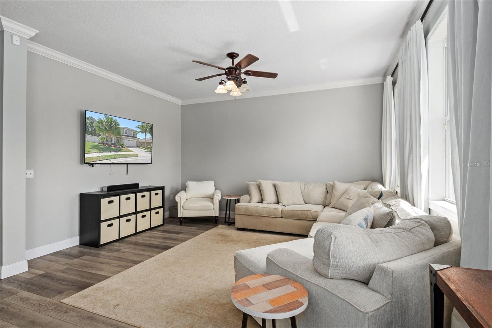 Family Room with Crown Molding and NEWER Luxury Flooring