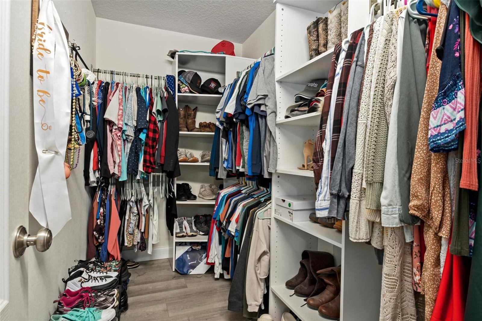 Master Bedroom Walk in Closet with Custom Shelving