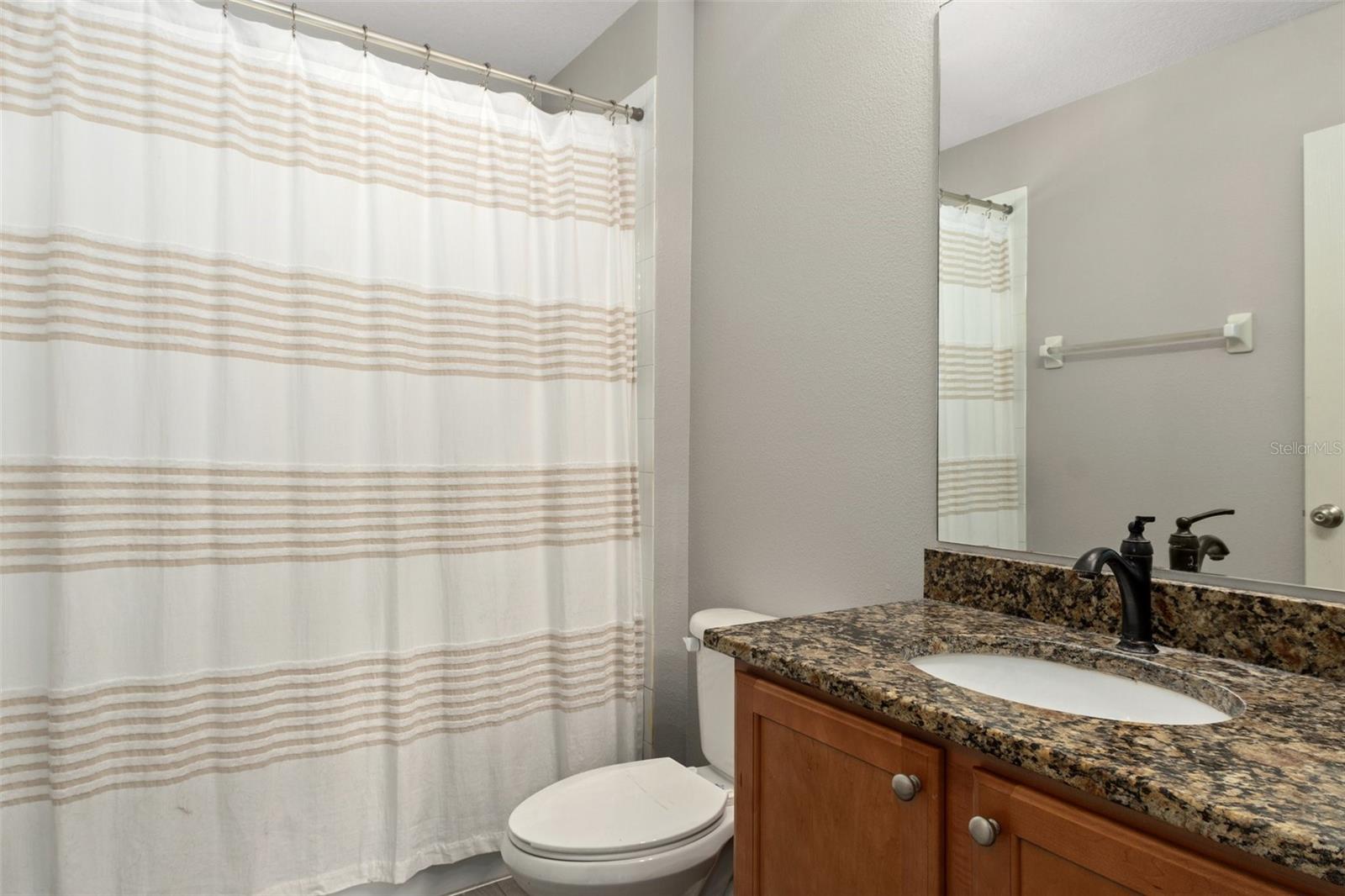 Upstairs Guest Bath with Granite Vanity and Tub