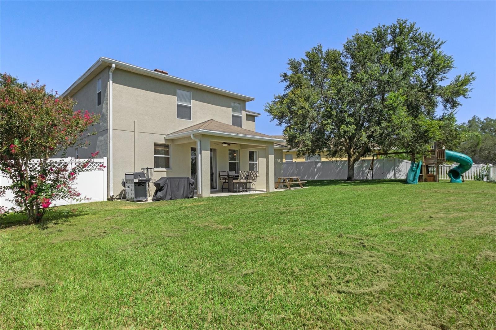 Rear of Home with Spacious Backyard