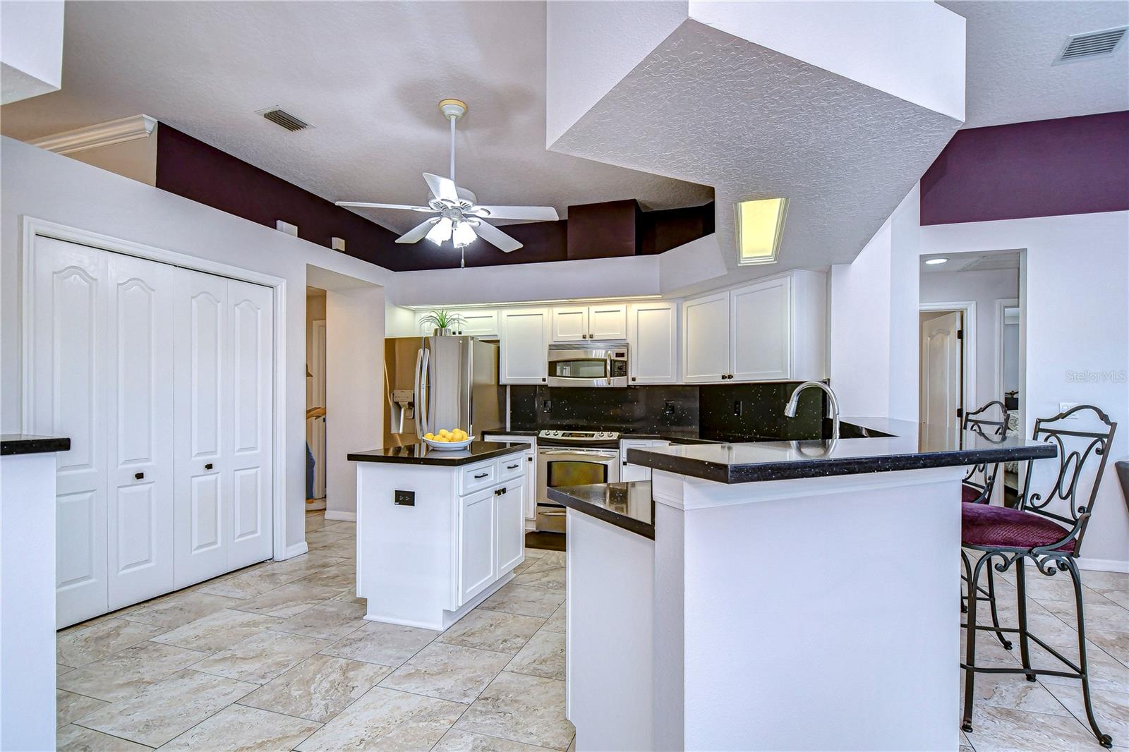 This beautifully designed kitchen boasts sleek countertops and ample storage, making it the heart of any get-together.