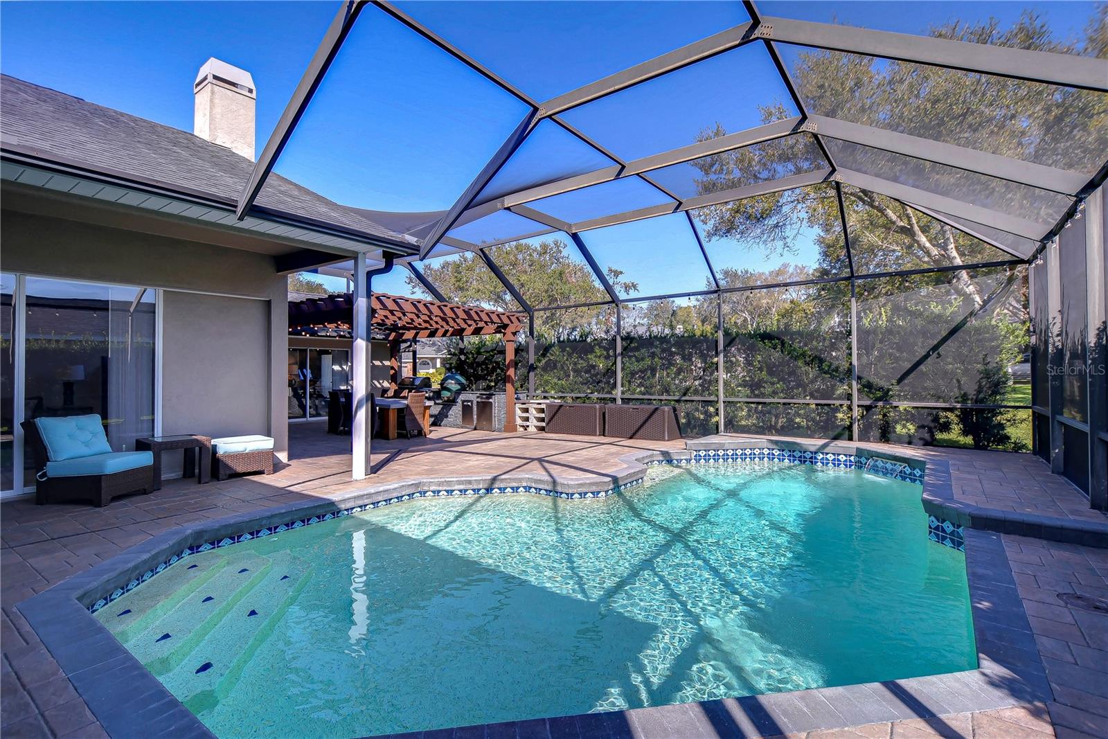 Imagine hosting sunny gatherings on the spacious patio, surrounded by privacy and serenity.