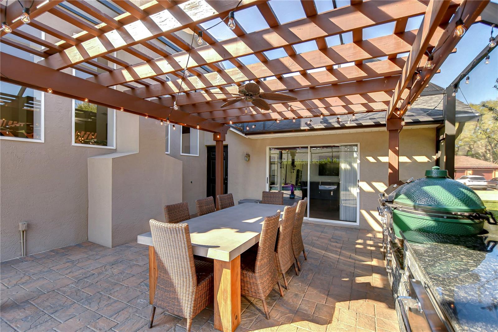 Dine al fresco under a charming pergola.