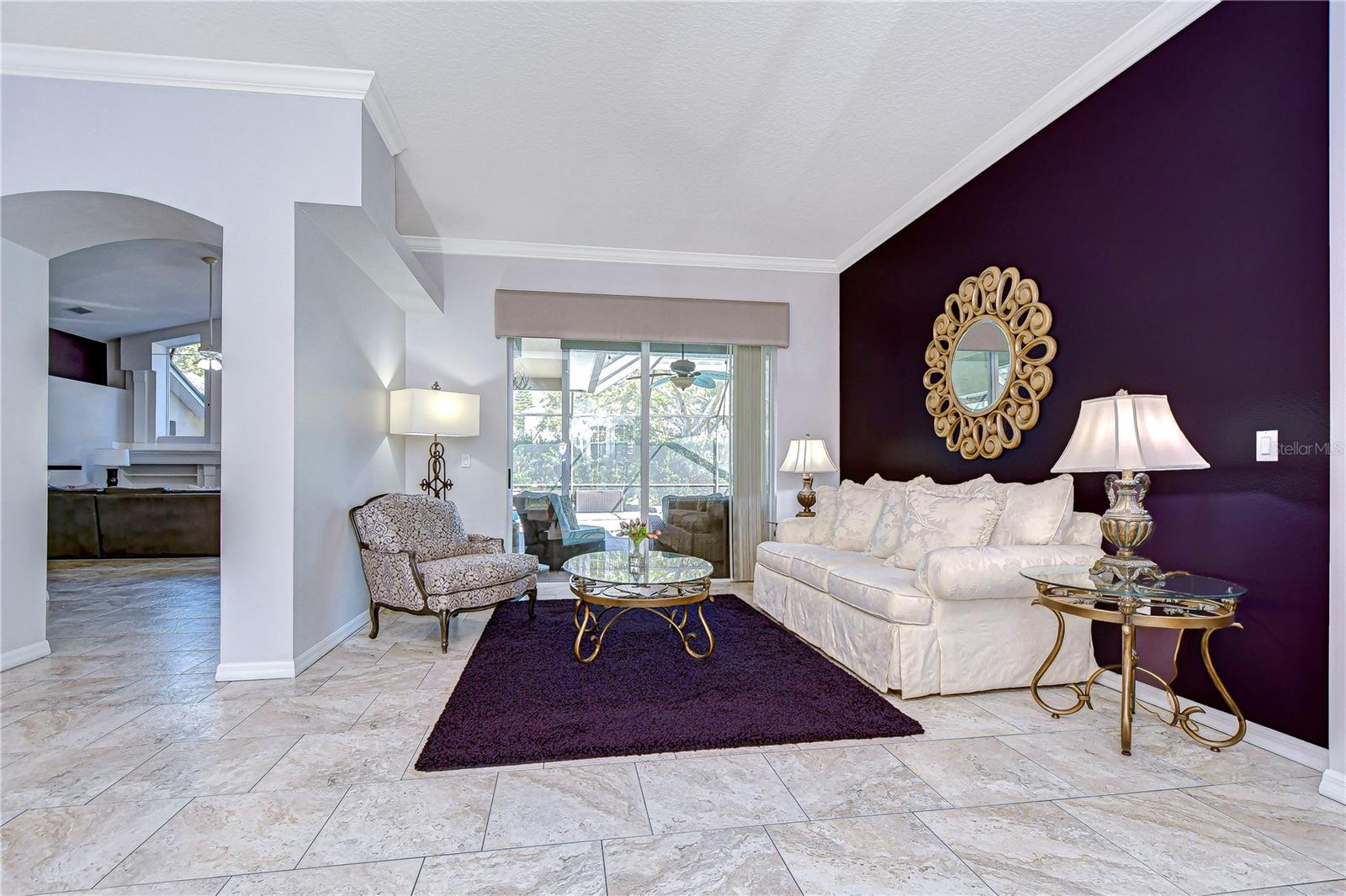 Formal living room offers plenty of space for lounging in luxury.