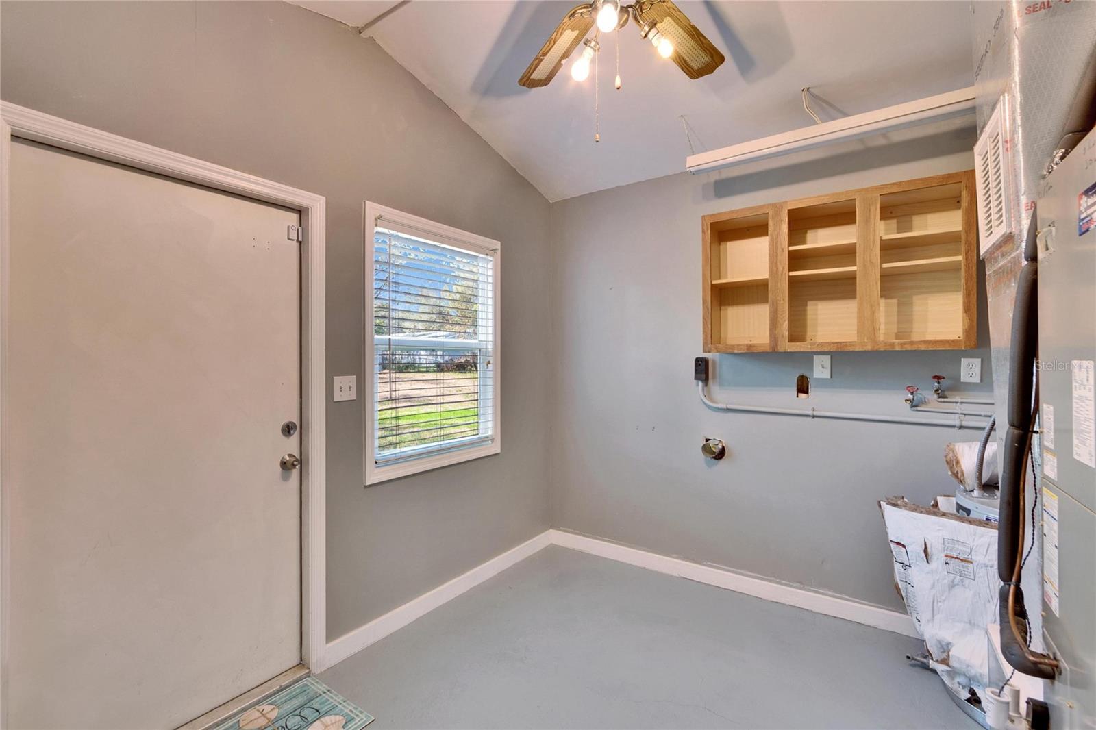 very large inside laundry with outside access can also be used as a mud room