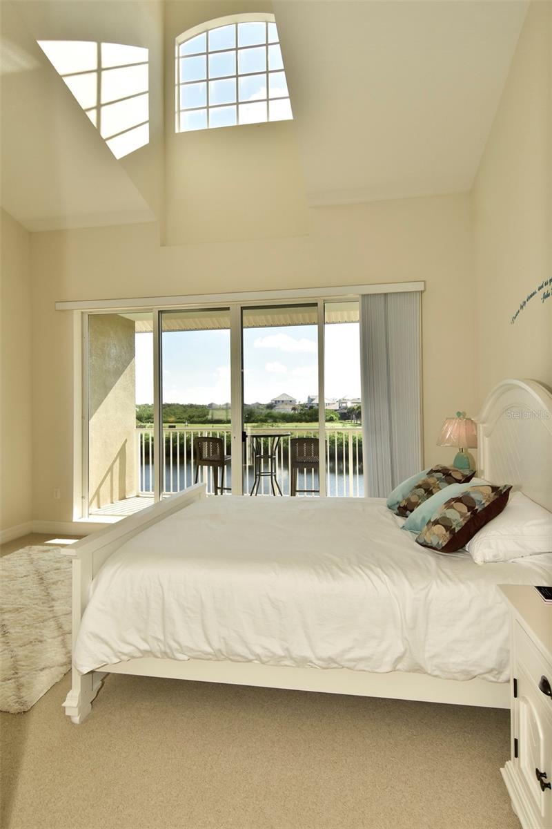 Primary Bedroom High Ceiling and Balcony Access