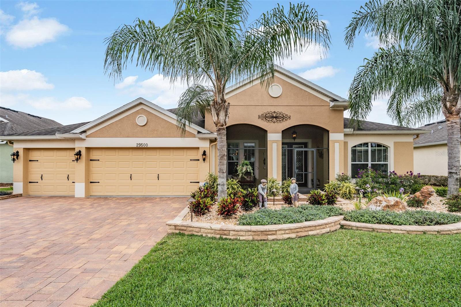 Lush lawn and 3 car garage too!