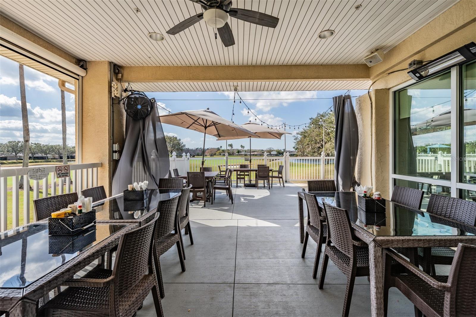 Outdoor seating on side patio of pub/grille