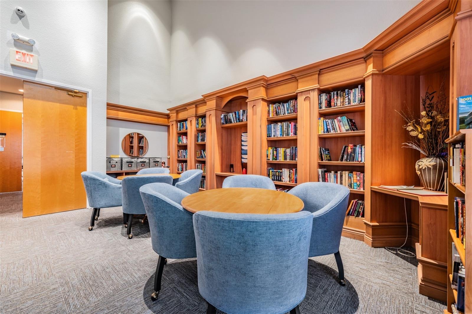 Library with books and computers in clubhouse