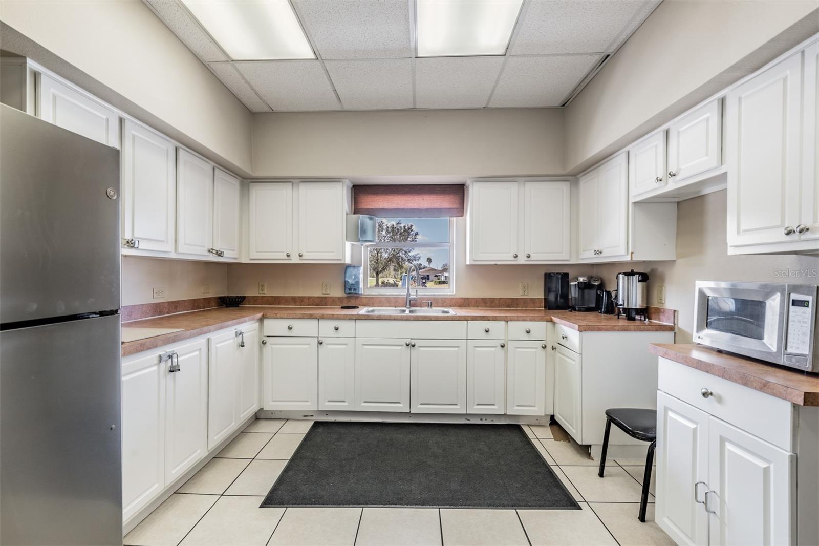 kitchen in activities center overlooks pool