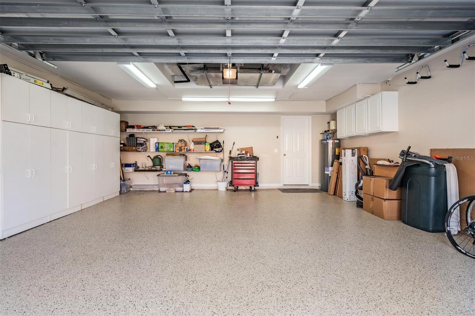 Garage with Epoxy Floors and Built in Storage