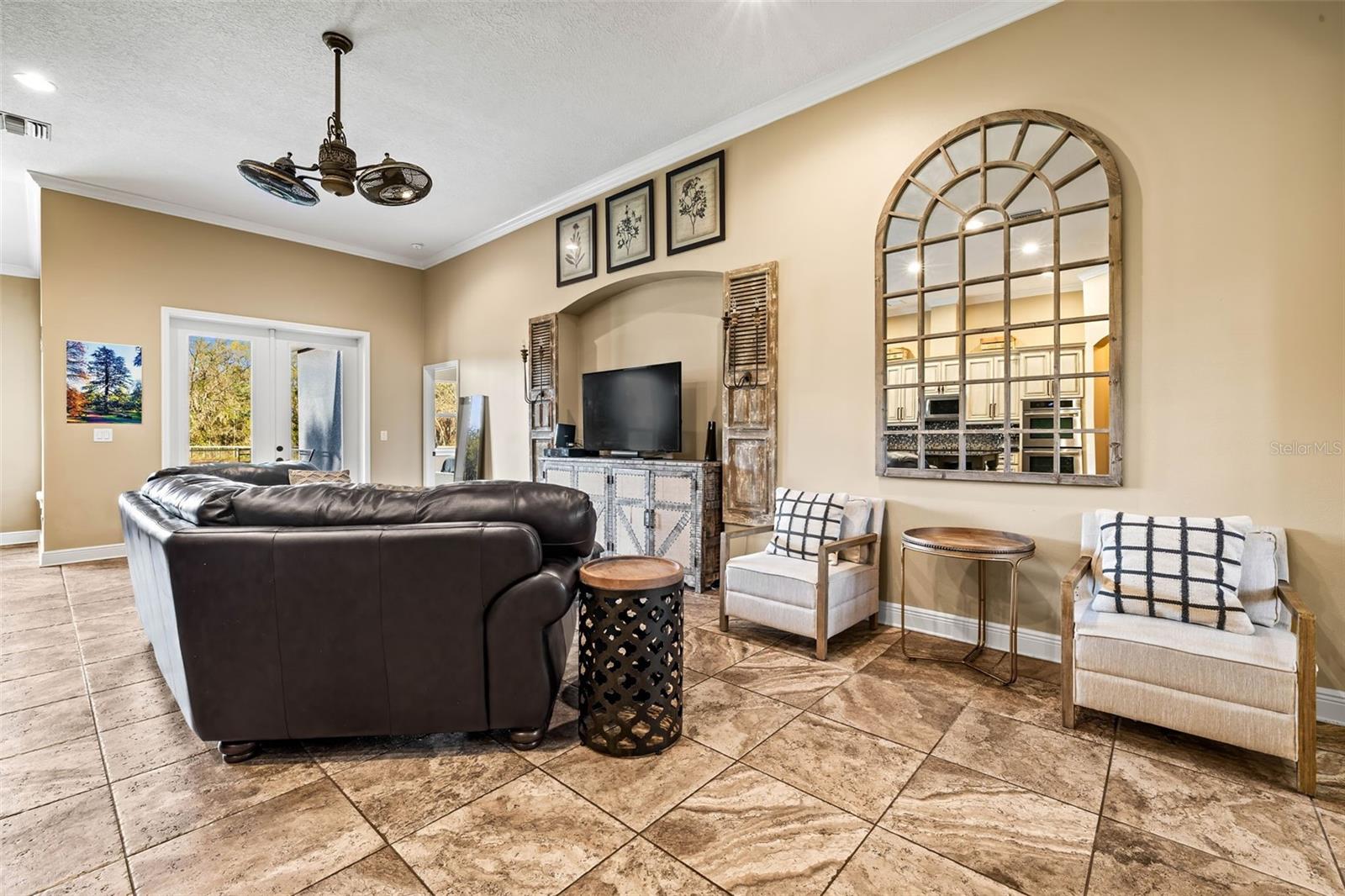 Great room/Family room with ceiling fan.