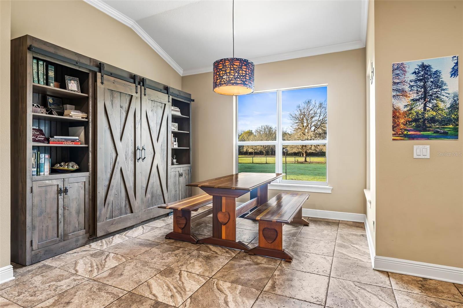 Dining room overlooking the fabulous back yard and back pasture.