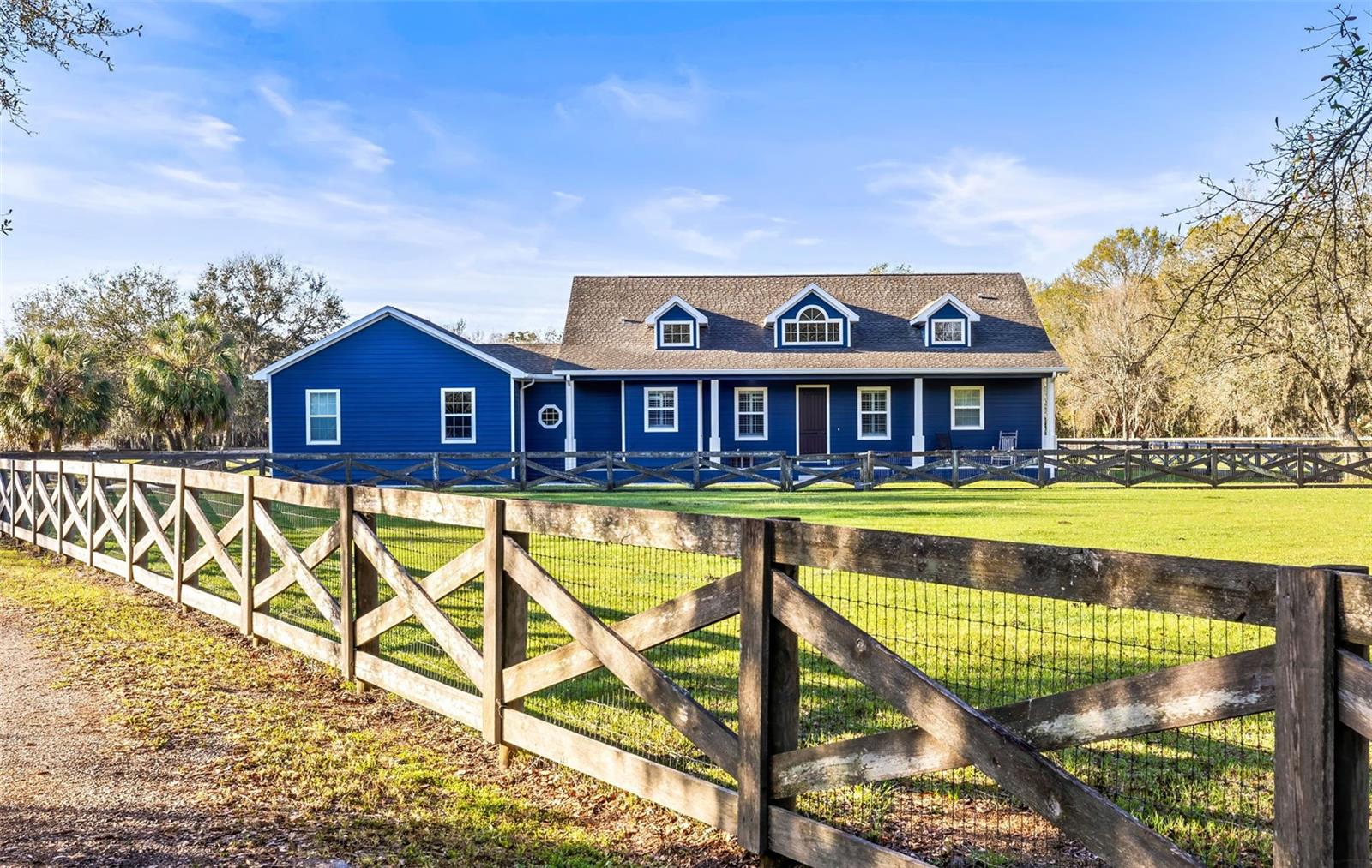 Front of house, front pasture with no climb fencing and protective top rail.