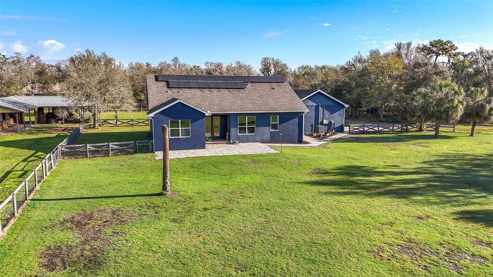 Aerial of backyard, house and barn.