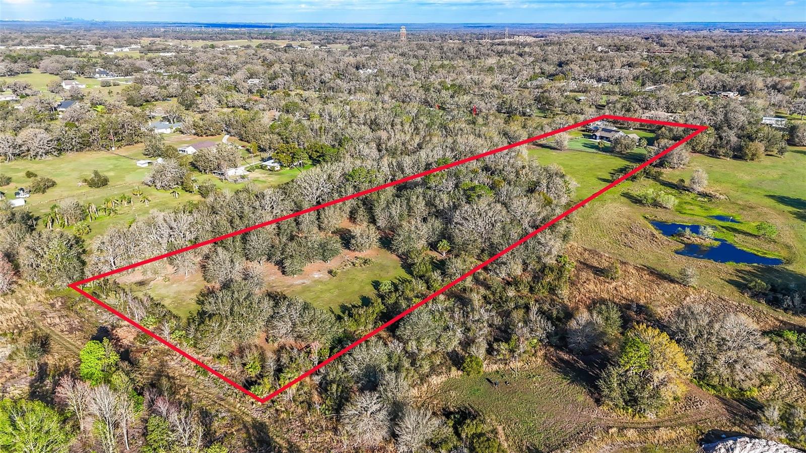 Red line represents and estimate of where the property lines are. Please confirm with a proper survey.