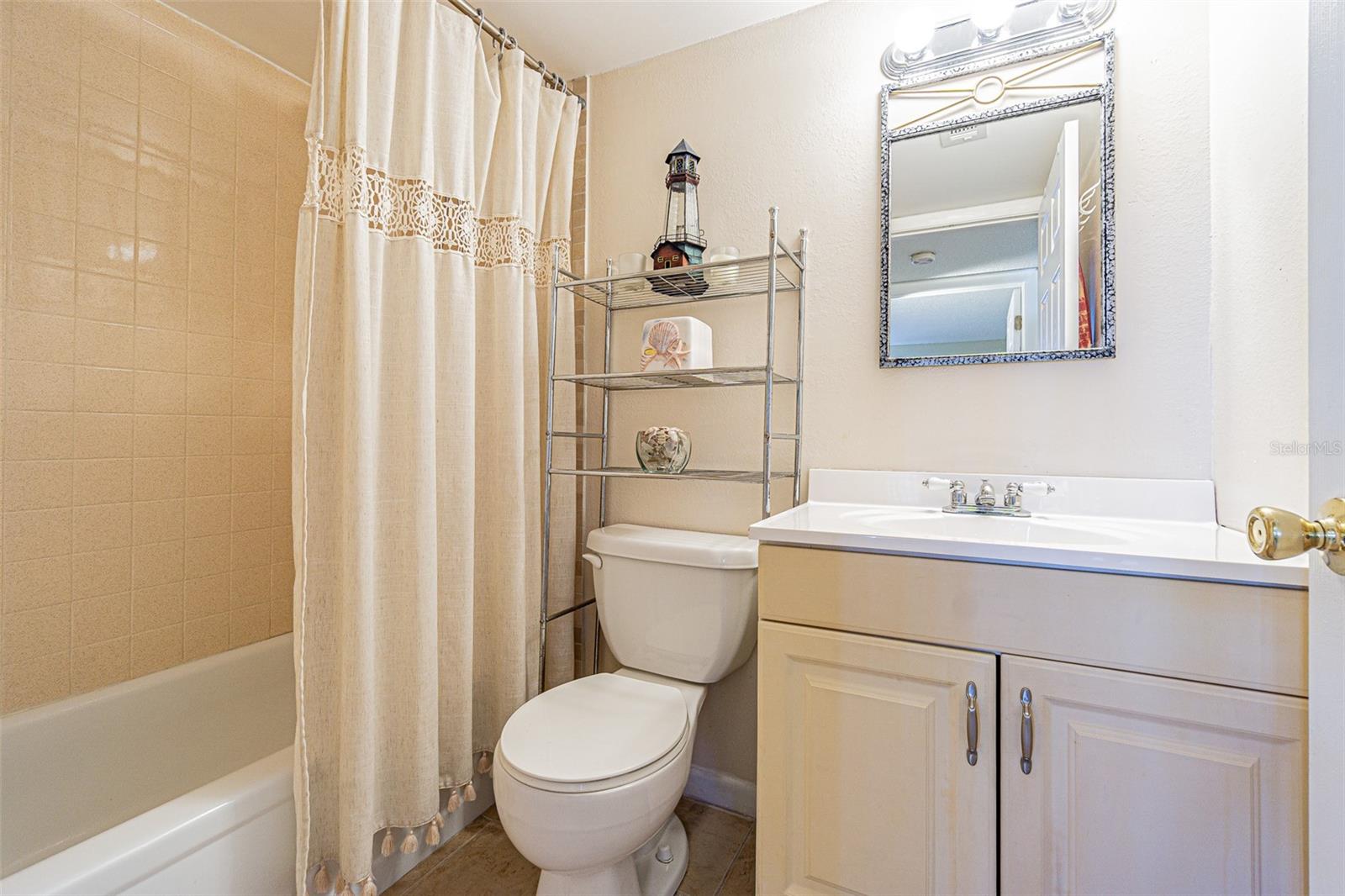 The Guest bathroom has a tub