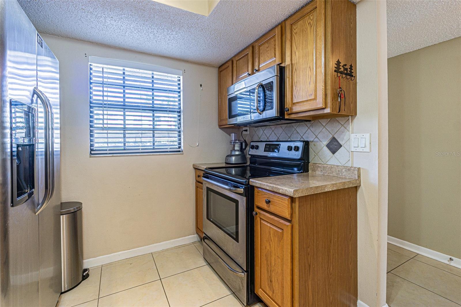 Stainless steel appliances with a newer microwave.