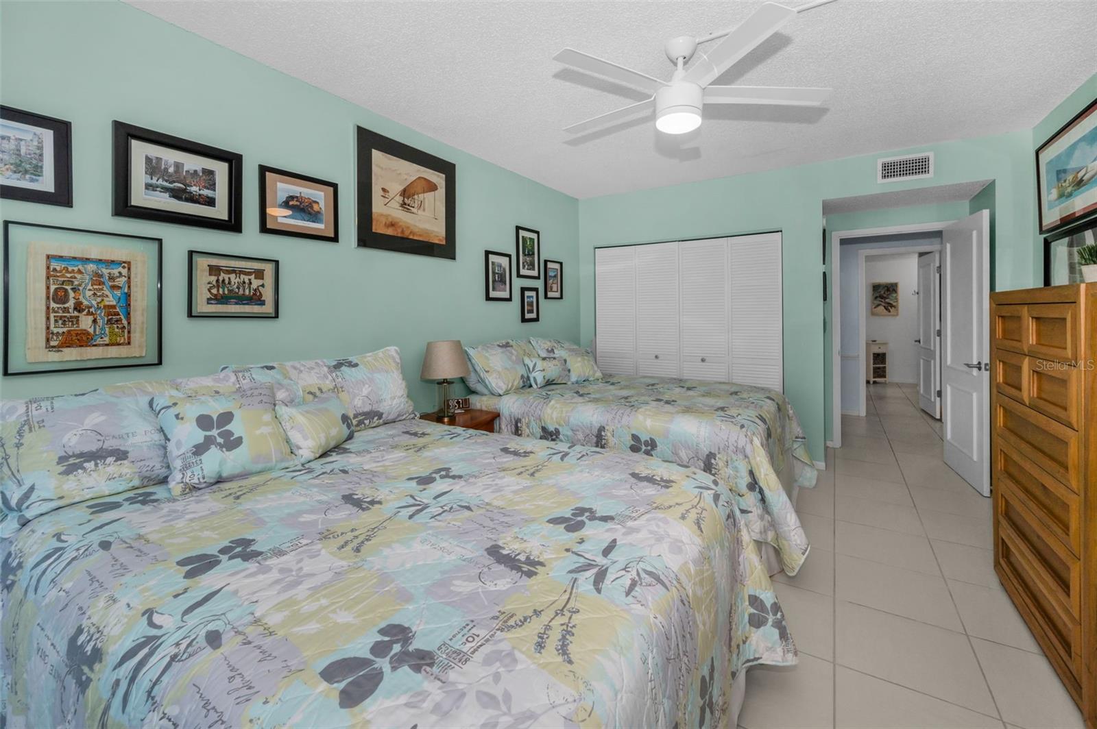 Looking across the hall at the gorgeous guest bath with walk in shower and all updated details!