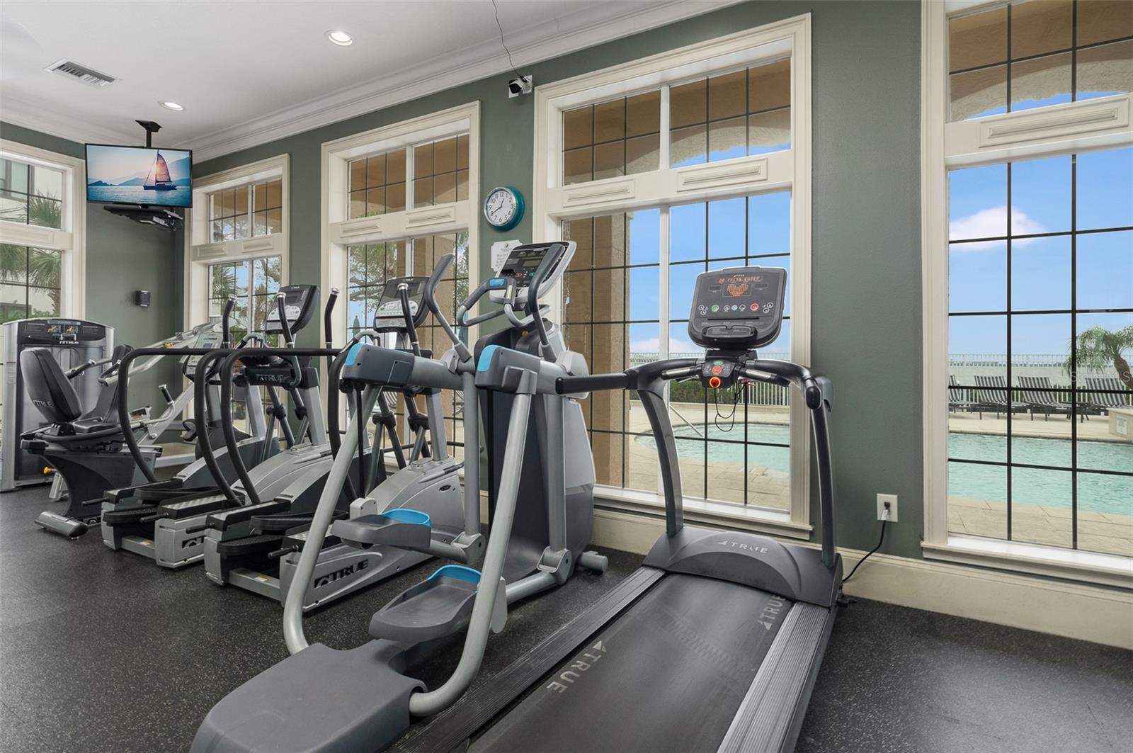 Fully equipped Fitness Room with Pool and Water Views