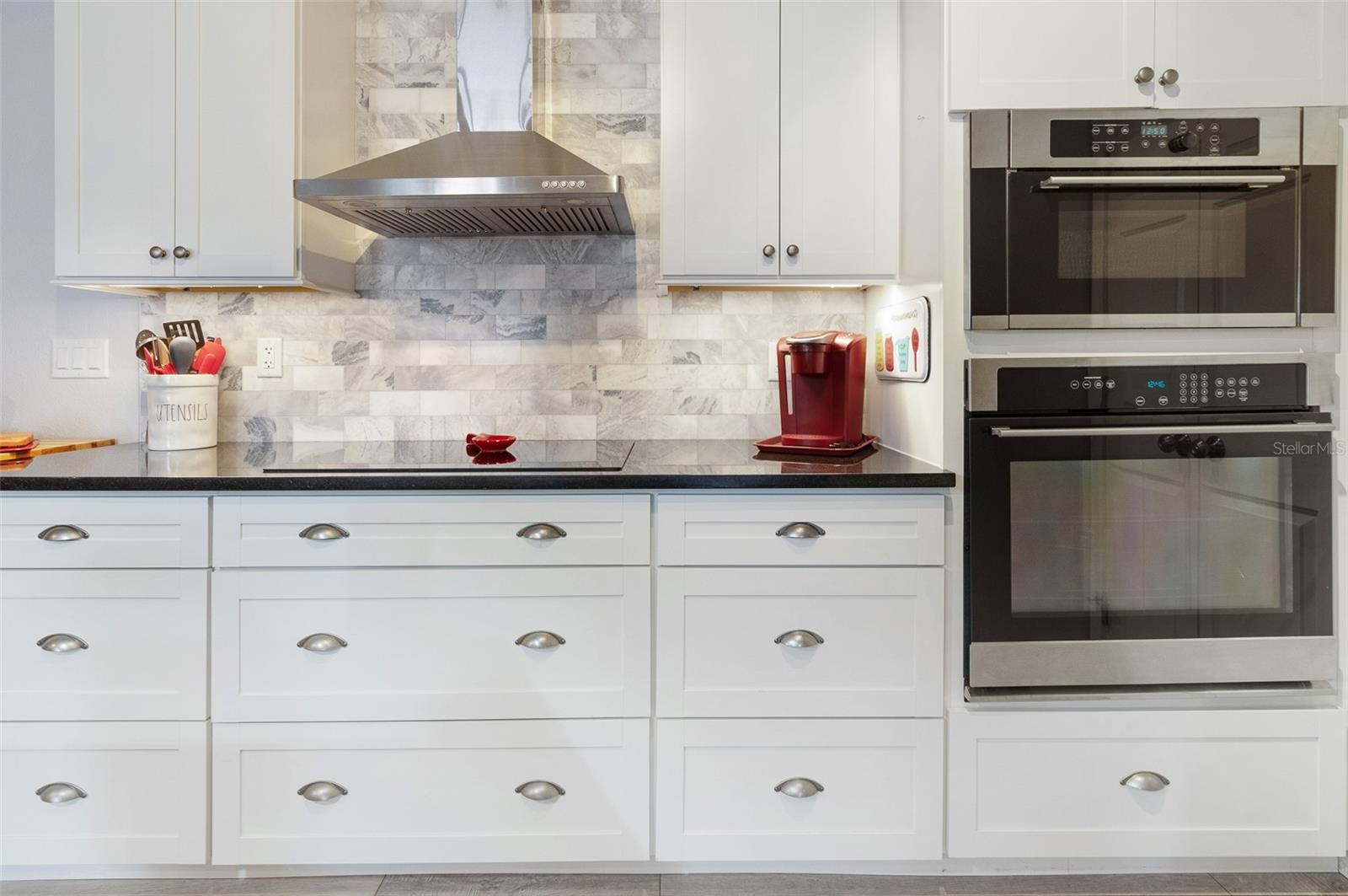 Induction Cooktop, with Built in Wall Oven and Micro with Carrera Marble Backsplash & upgrade Cabinets