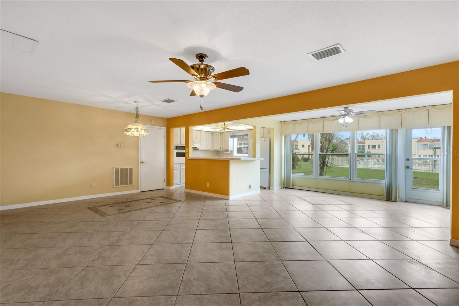 Living Room Open to Kitchen and Florida Room