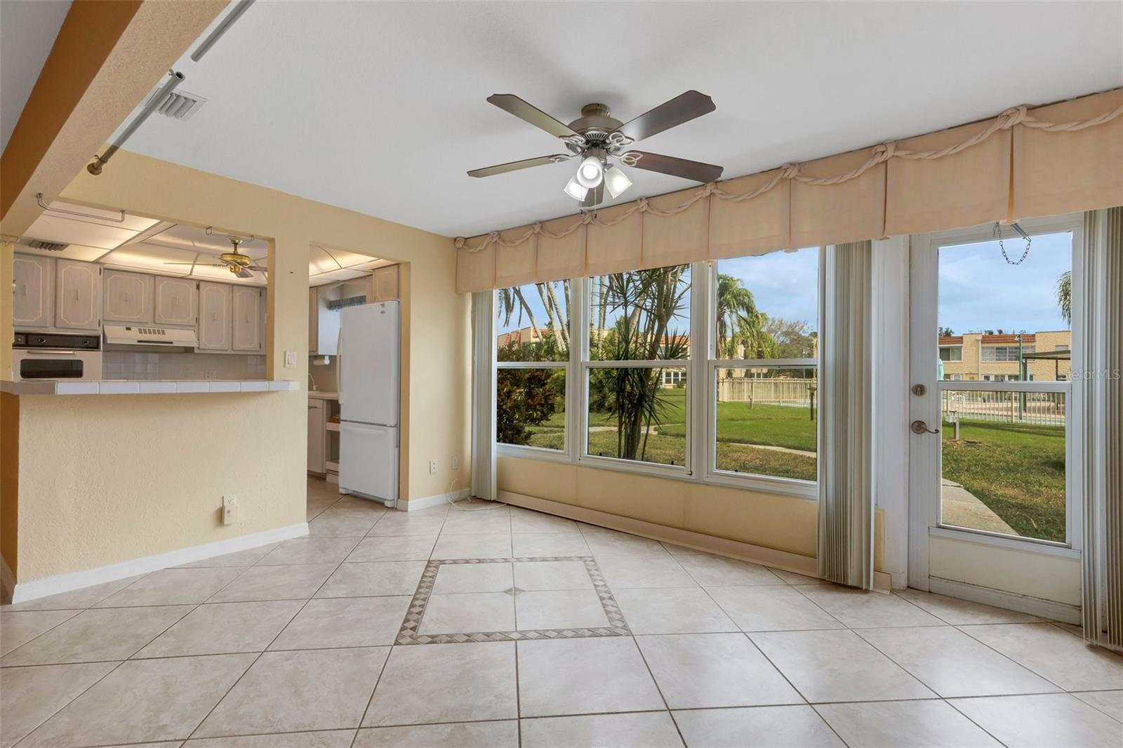 Florida Room with Pedestrian Door to Pool and Clubhouse