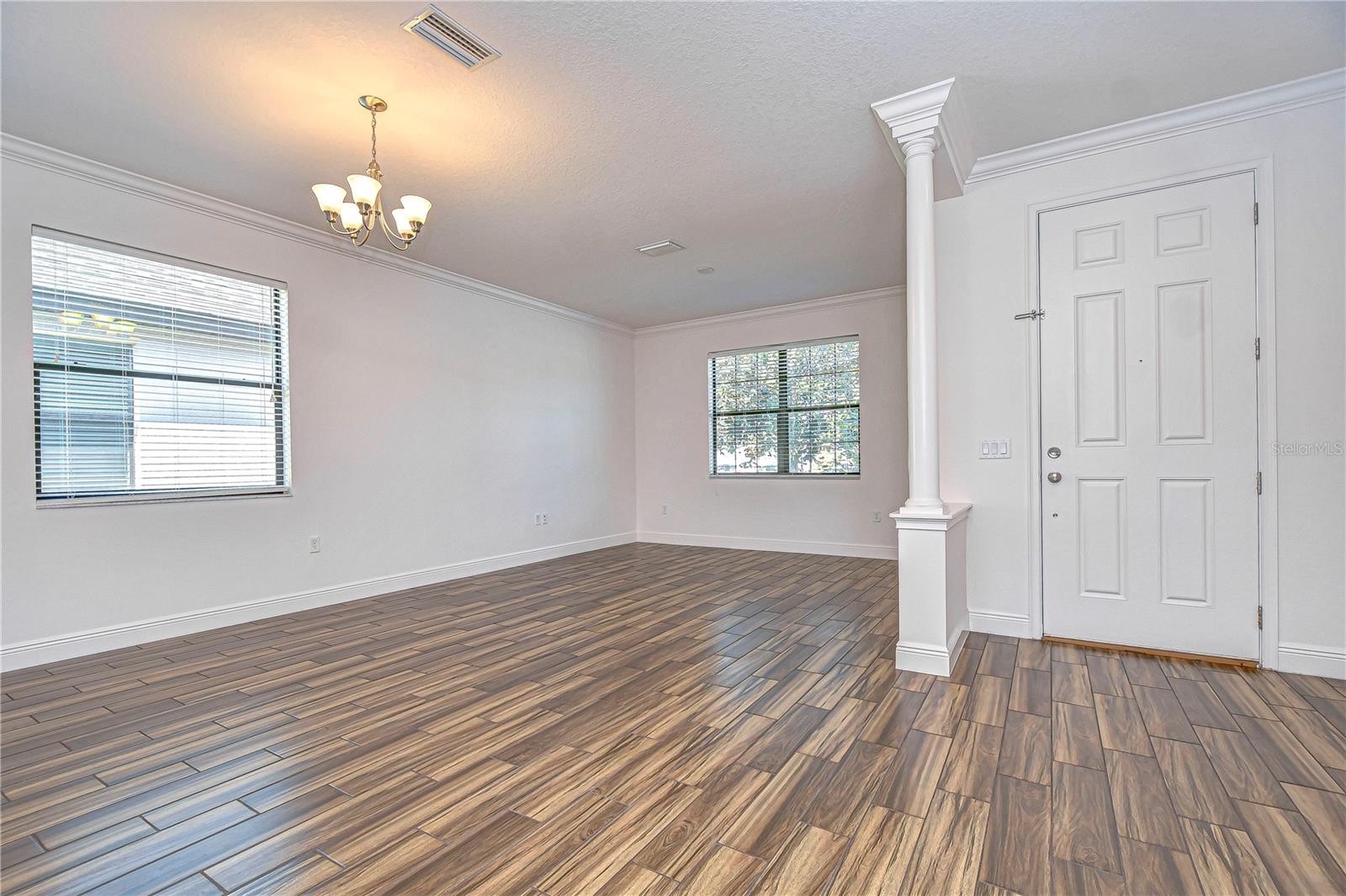 Step into the entryway with abundant natural light in this welcoming entryway.