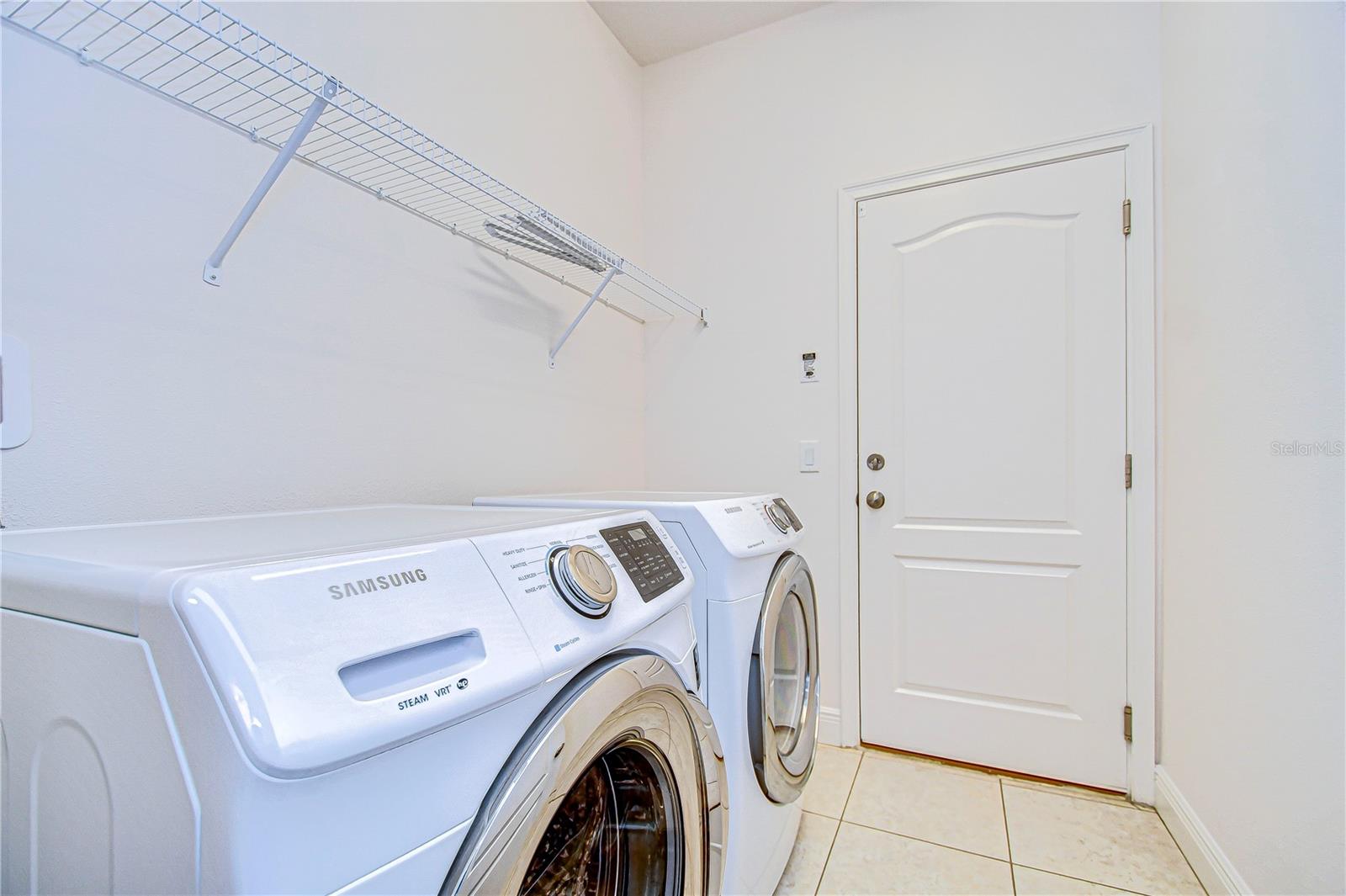 Effortless laundry days with this modern laundry room setup.