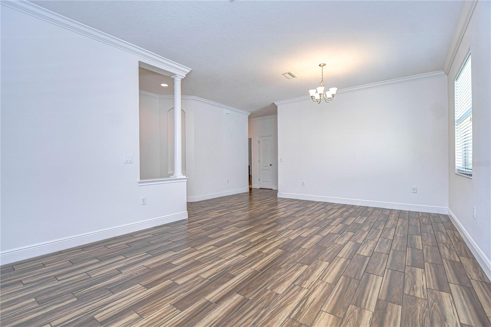 Elegant open floor plan with sleek flooring and modern finishes allows for endless decor possibilities.