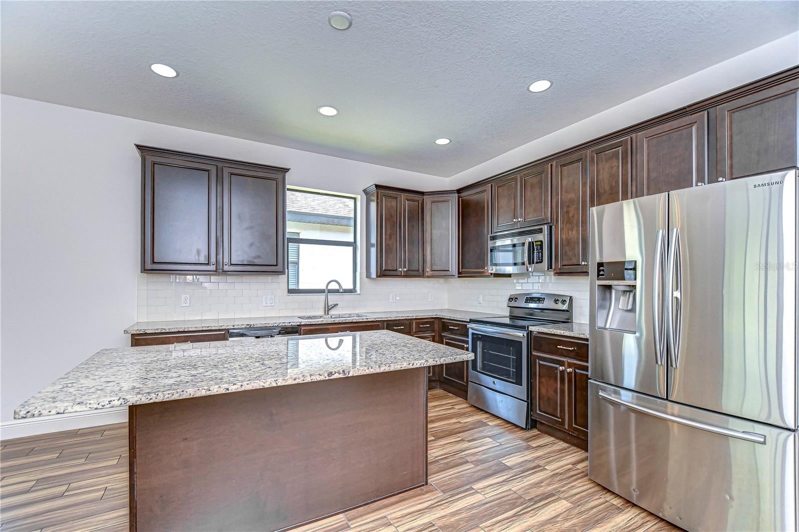 Step into culinary bliss with this stylish kitchen.