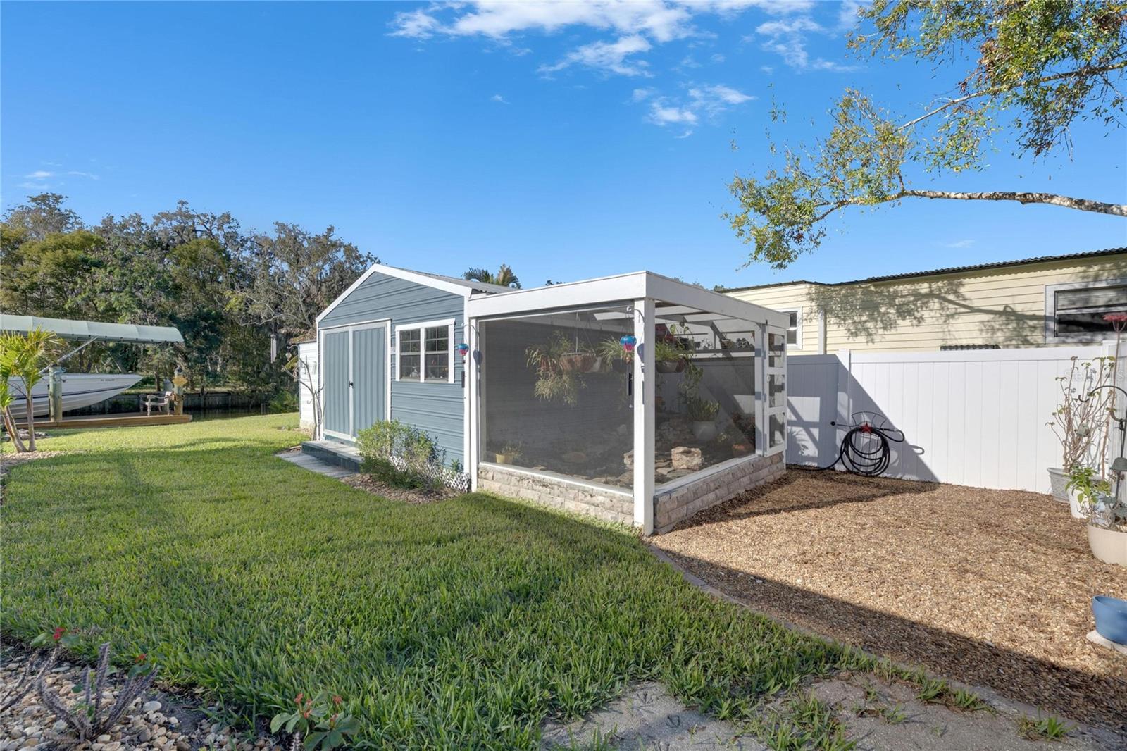 STORAGE BUILDING AND KOI POND