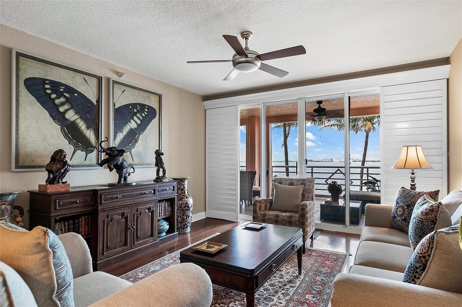 Another view of the formal living room with plantation shutters