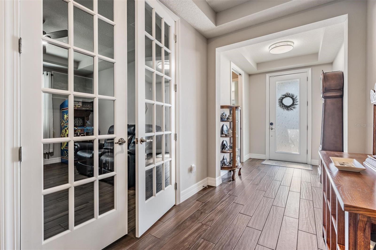 Entry way, french doors into den/bonus room