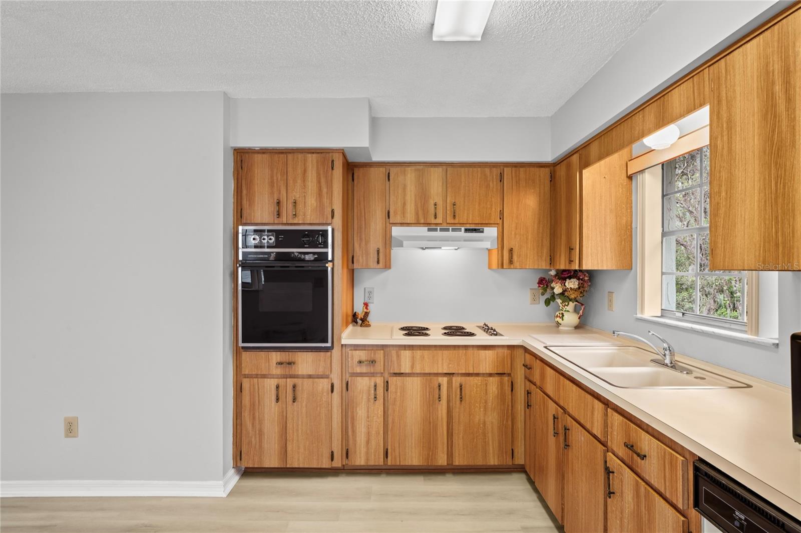 More of the interior of the kitchen, there are numerous cabinets for storage.