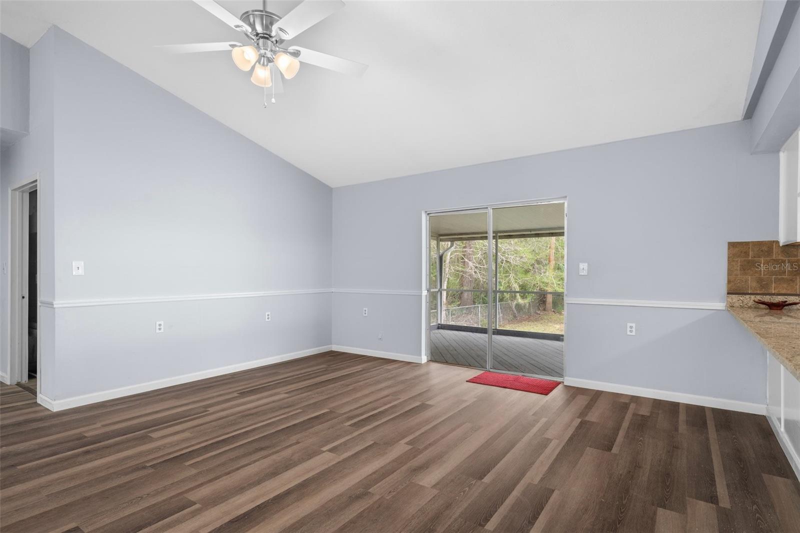 There are sliding glass doors out to the screened in porch