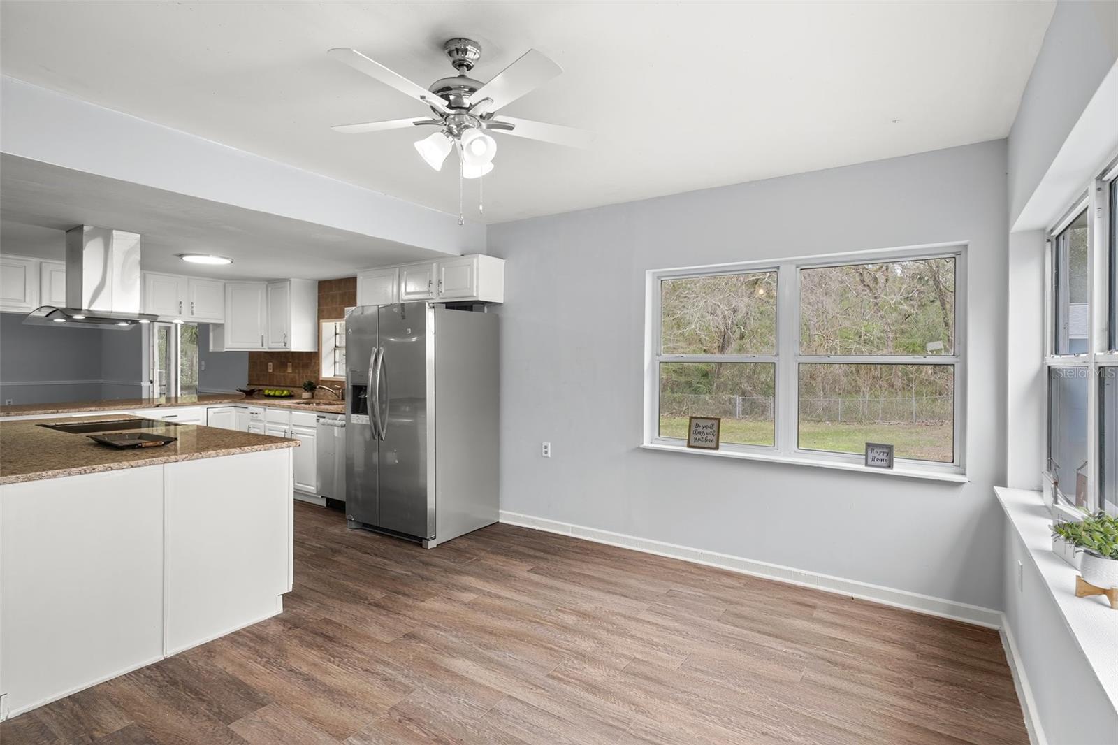 There are lots of windows in the breakfast nook making it a bright and beautiful space