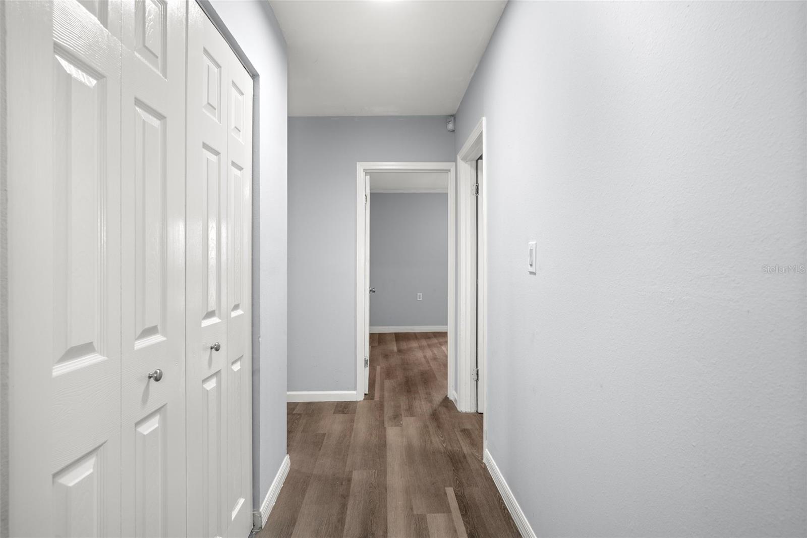 Hallway to the other Bedrooms with a linen closet next to the master bedroom