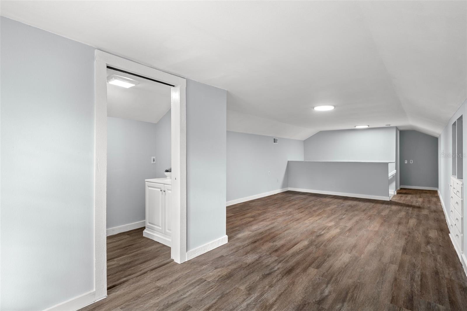 View of the bedroom and the entrance to the walk-in closet