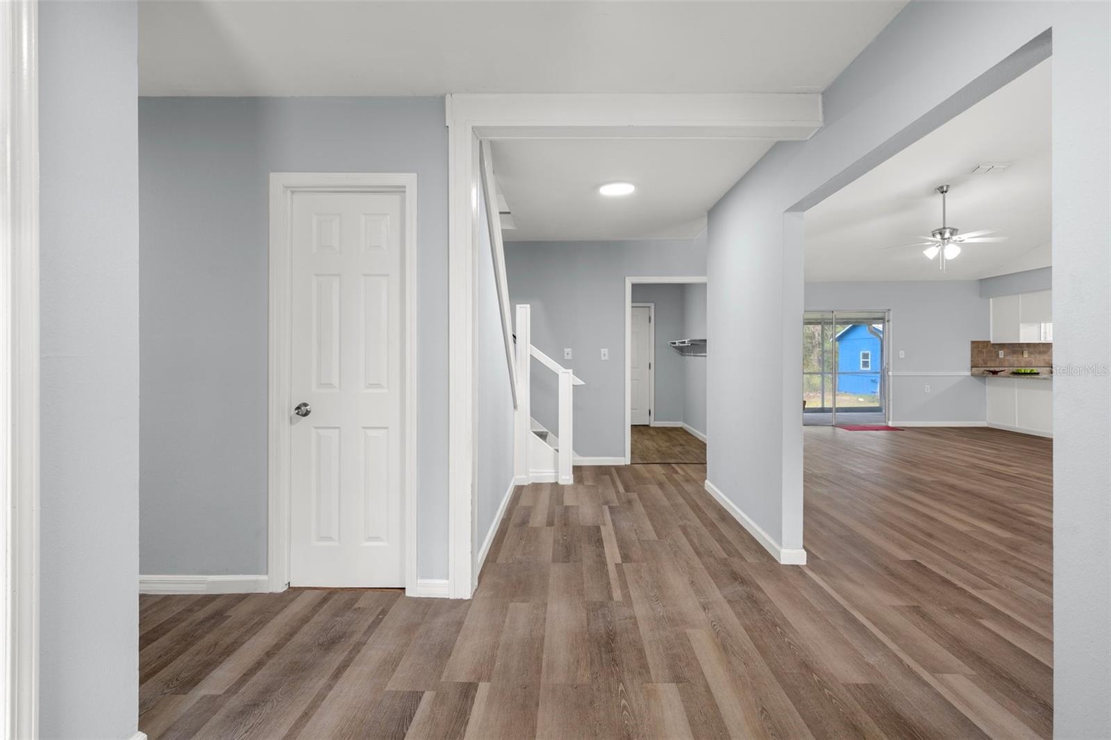 View from the front door, the door to the left is the door is to a convient storage area under the stairs. This is also a coat closet