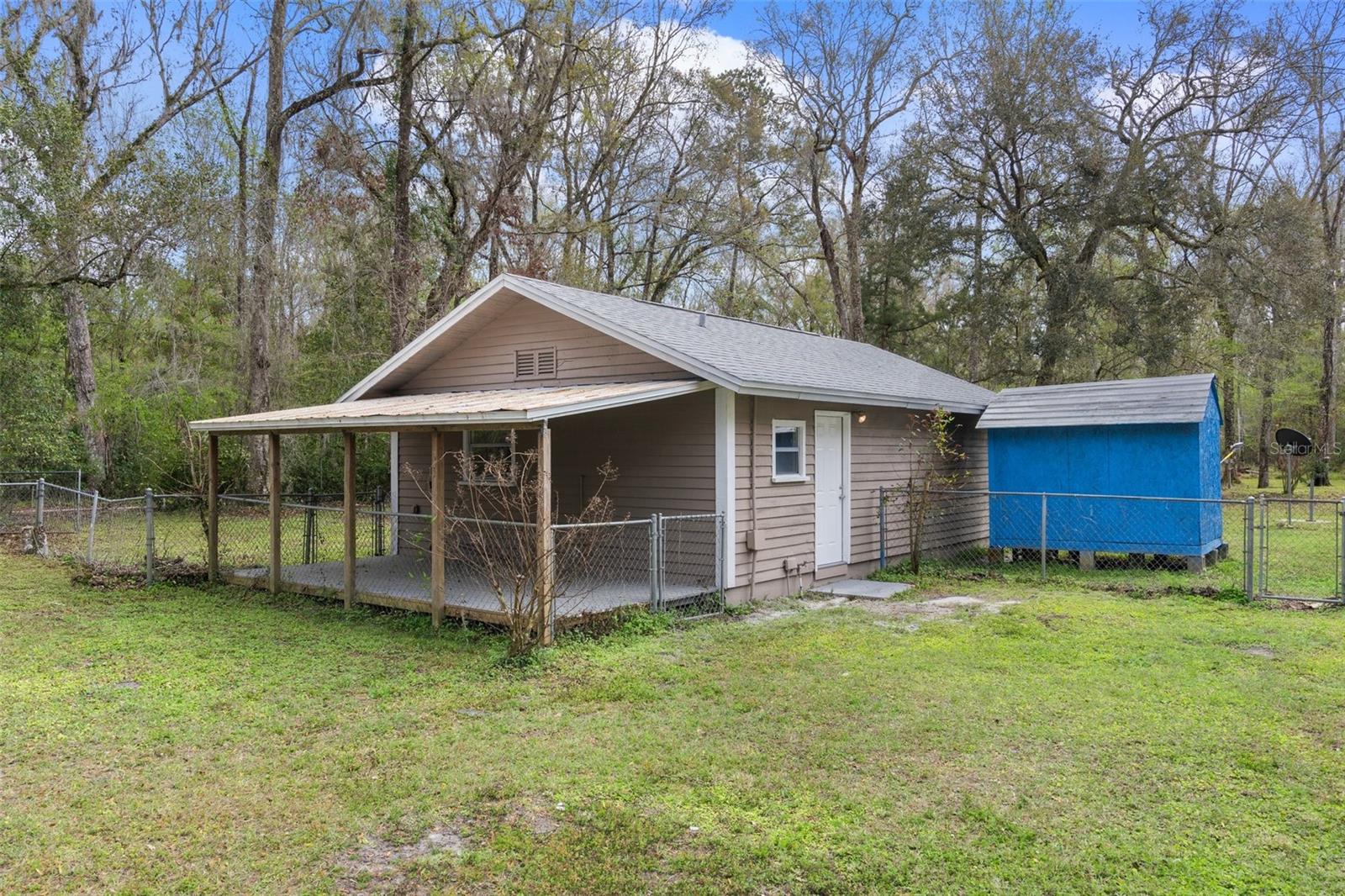 Back of the studio guest home with an open porch