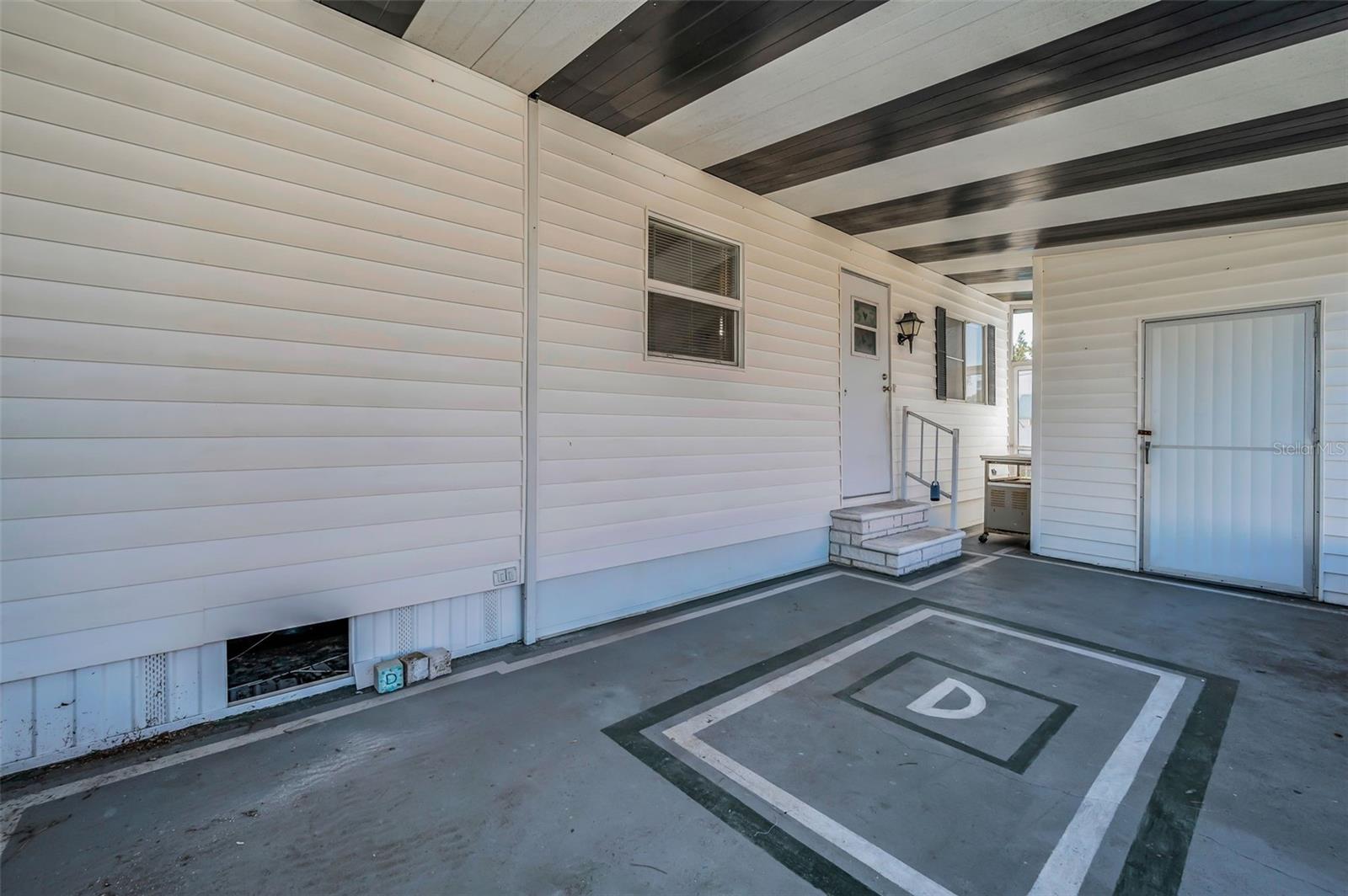 View of Lanai, side door and entrance to shed