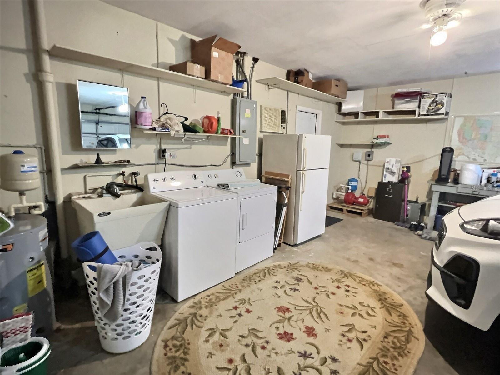 Washer, Dryer, and Extra Refrigerator in Garage